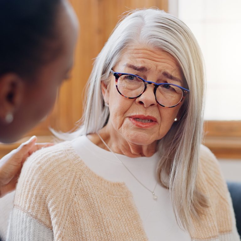 SC-Elderspeak-sad-woman-speaking-nurse-with-support-caregiver-1200wSq